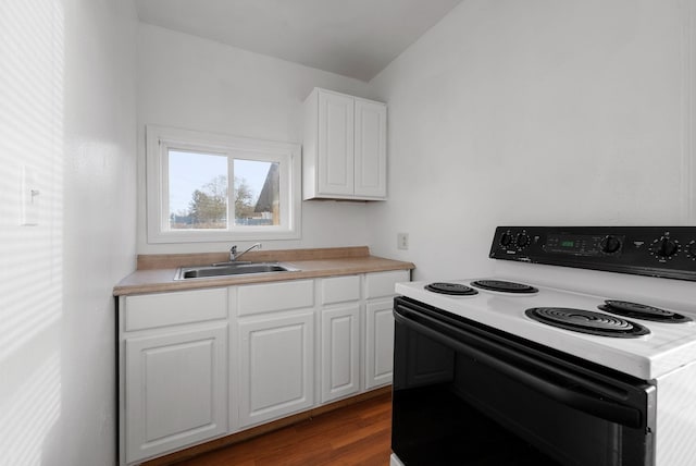 kitchen featuring white range with electric stovetop, white cabinetry, sink, and dark hardwood / wood-style floors