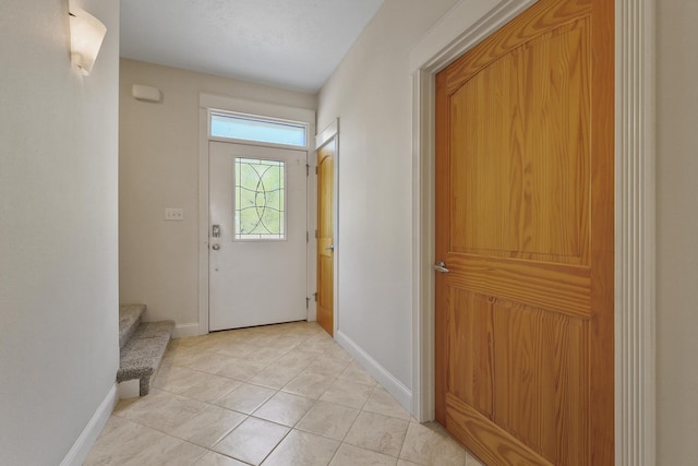 doorway featuring light tile patterned flooring