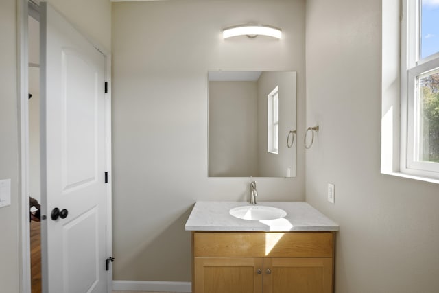 bathroom featuring a wealth of natural light and vanity