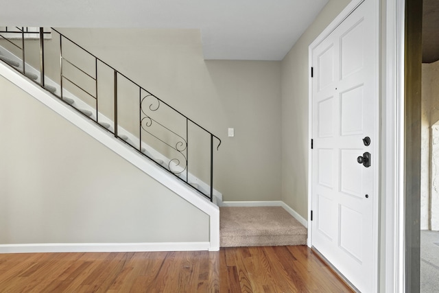 foyer entrance with hardwood / wood-style flooring