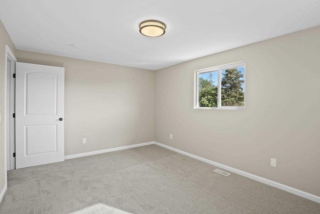 empty room featuring carpet floors