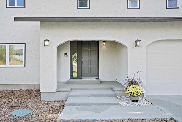 property entrance featuring a garage