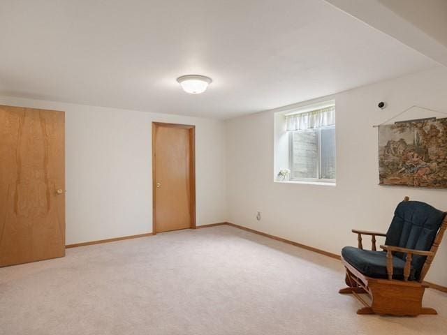 sitting room with carpet floors