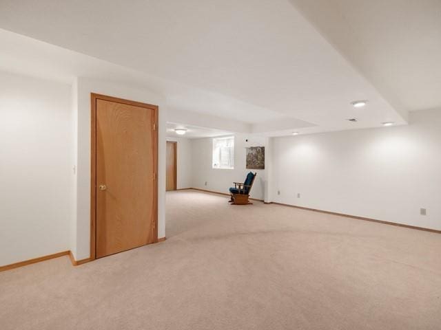 interior space featuring light colored carpet