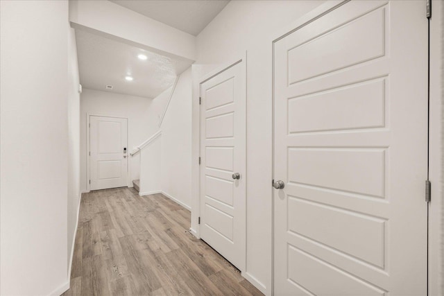 hallway featuring light hardwood / wood-style flooring