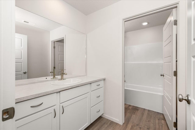 bathroom featuring vanity and wood-type flooring