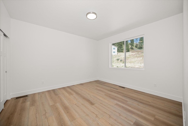 4233 W Tolliver Ct, Spokane, WA 99208 - unfurnished bedroom featuring light wood-style floors