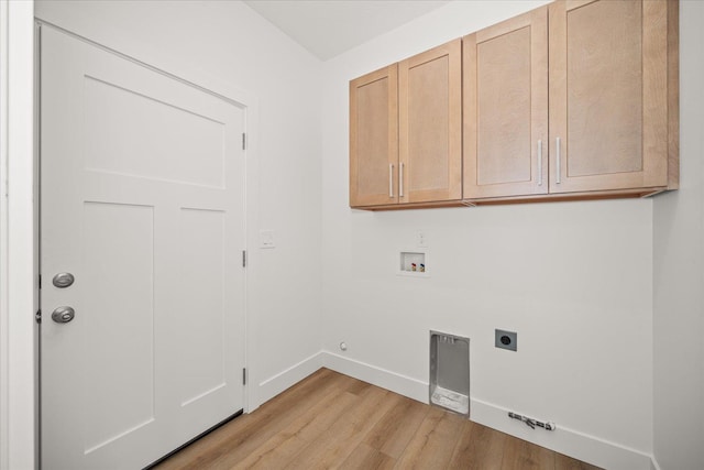 4233 W Tolliver Ct, Spokane, WA 99208 - laundry area with gas dryer hookup, hookup for an electric dryer, light wood-style floors, hookup for a washing machine, and cabinet space