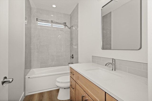 4233 W Tolliver Ct, Spokane, WA 99208 - full bathroom with vanity, shower / washtub combination, and wood finished floors