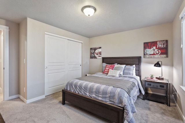 carpeted bedroom with a closet