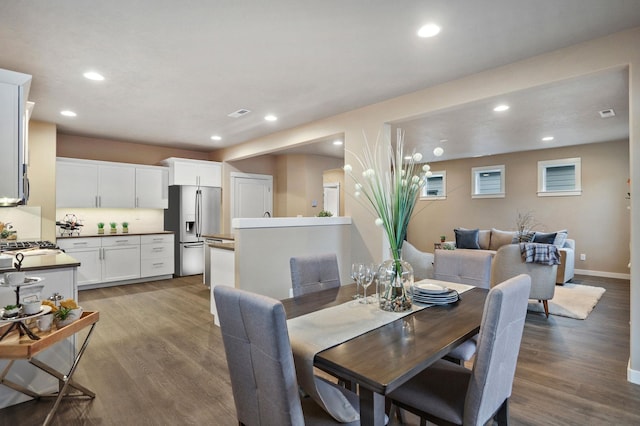 dining room with hardwood / wood-style flooring