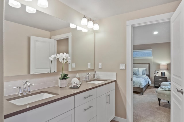 bathroom with decorative backsplash and vanity