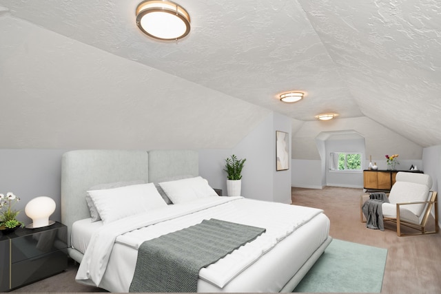 bedroom featuring lofted ceiling, carpet floors, and a textured ceiling