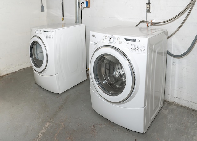 clothes washing area featuring independent washer and dryer