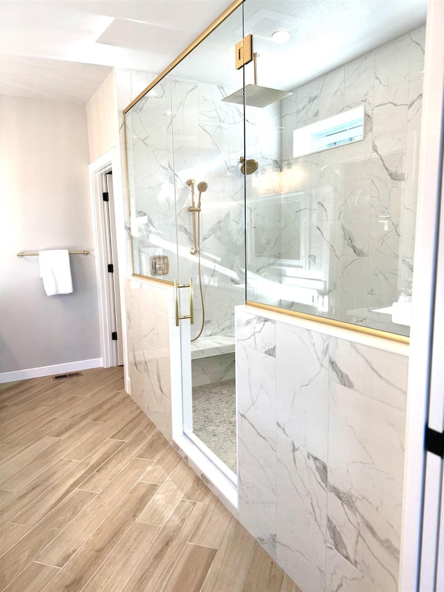 bathroom with an enclosed shower