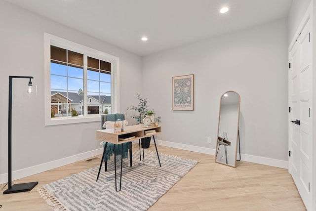 office space with light hardwood / wood-style floors