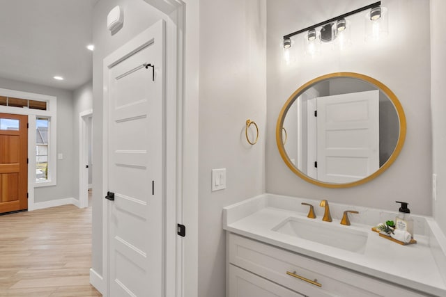 bathroom with wood-type flooring and vanity