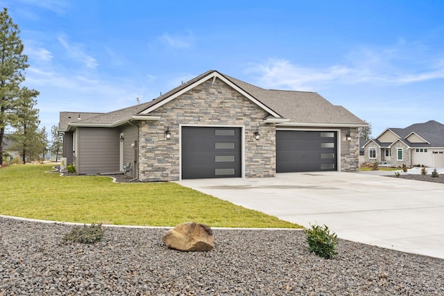 view of front facade with a garage and a front lawn