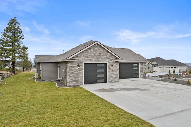 view of front facade with a garage and a front lawn