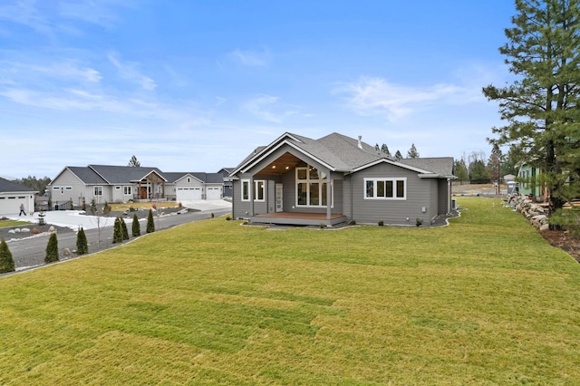 back of house featuring a yard