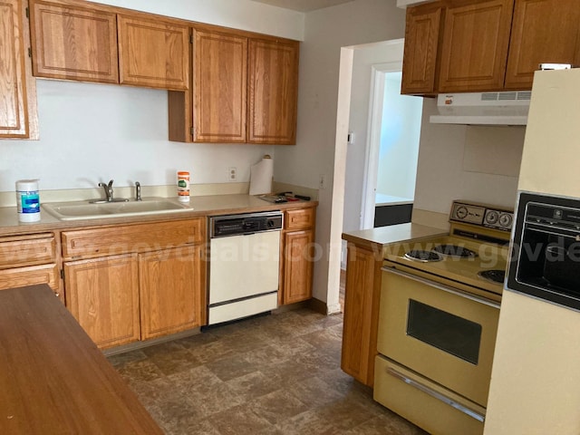 kitchen with sink and white appliances