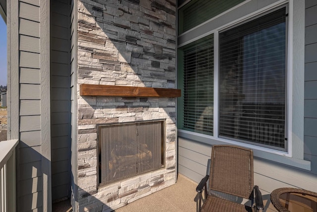 details featuring an outdoor stone fireplace