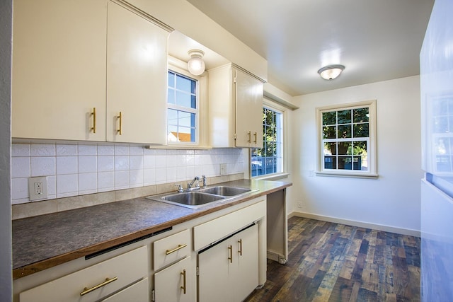 kitchen with decorative backsplash, sink, white cabinets, and dark hardwood / wood-style floors