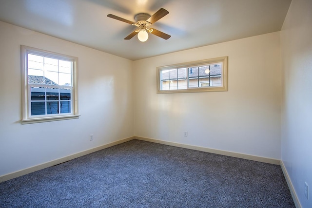 spare room featuring ceiling fan and carpet floors