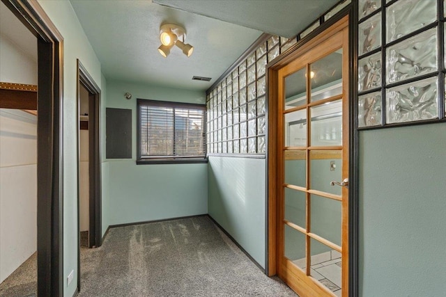 corridor with dark colored carpet