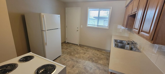6408 N Normandie St, Spokane, WA 99208 - kitchen featuring stove, white fridge, and sink