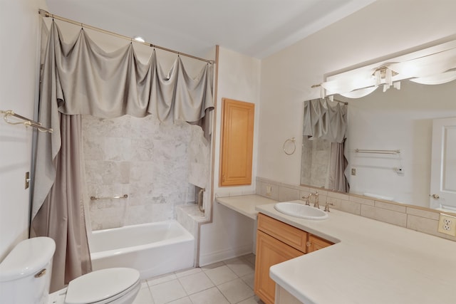 bathroom featuring tile patterned floors, tasteful backsplash, vanity, and toilet