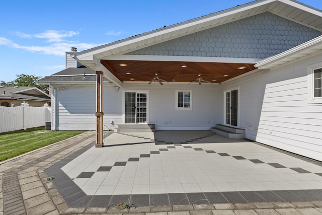 back of property with a patio area and ceiling fan