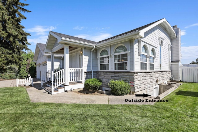 view of front of property with a front lawn and a garage