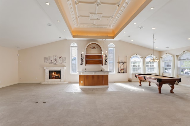 playroom featuring light carpet, a high ceiling, a tray ceiling, and billiards