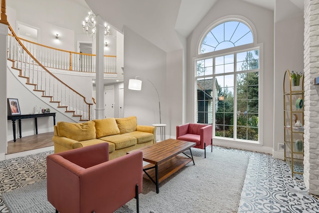 tiled living room with a towering ceiling and plenty of natural light