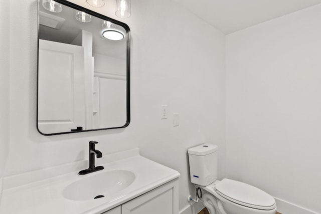 bathroom with vanity and toilet