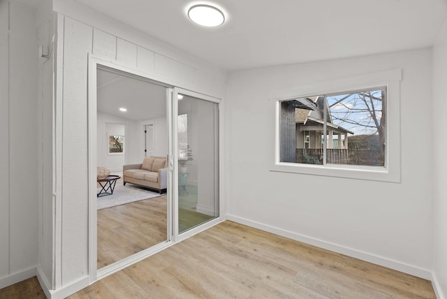 interior space featuring hardwood / wood-style floors, a closet, and lofted ceiling