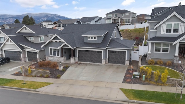 view of front of house with a mountain view and a garage