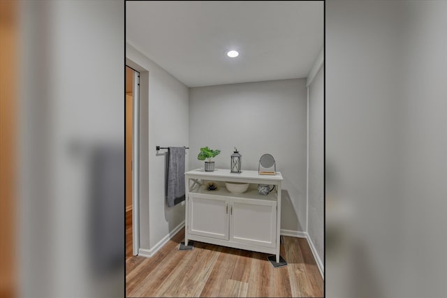 bathroom with wood-type flooring