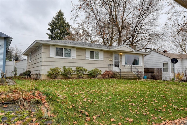 single story home featuring a front yard