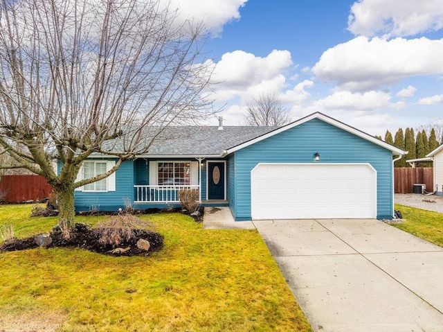 single story home with a garage and a front lawn