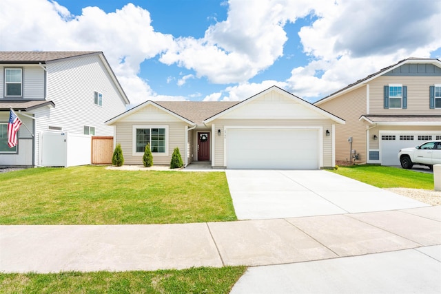 view of front of house with a garage and a front lawn