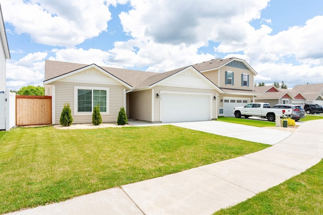 view of front of house with a garage and a front yard