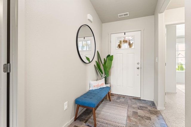 view of carpeted entrance foyer