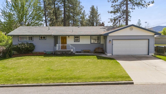 ranch-style home featuring a front lawn and a garage