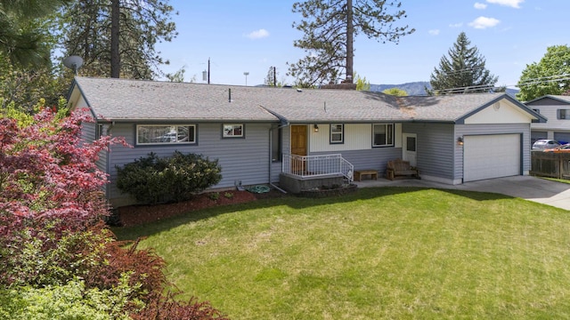 ranch-style house with a garage and a front lawn