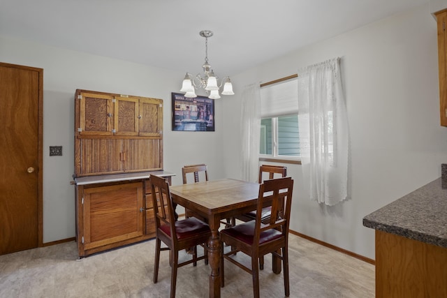 dining space with a chandelier