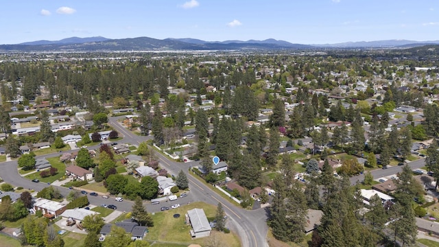 birds eye view of property with a mountain view