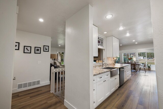 1323 E Deerhaven Ave Dalton Gardens, Dalton Gardens, Coeur D Alene, ID 83815 - kitchen featuring white cabinetry, dishwasher, light stone countertops, and sink