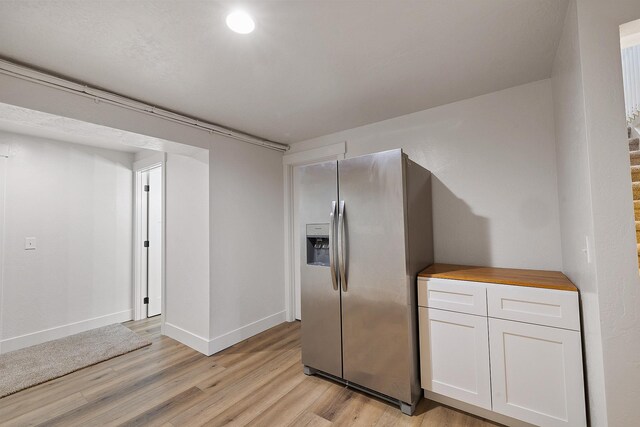 1323 E Deerhaven Ave Dalton Gardens, Dalton Gardens, Coeur D Alene, ID 83815 - kitchen with wood counters, stainless steel fridge, white cabinets, and light hardwood / wood-style floors